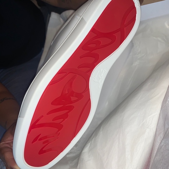 tennis shoes with red bottoms